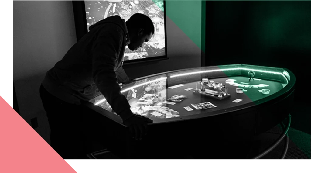 A man looking at an oval museum display. Photo in black and white